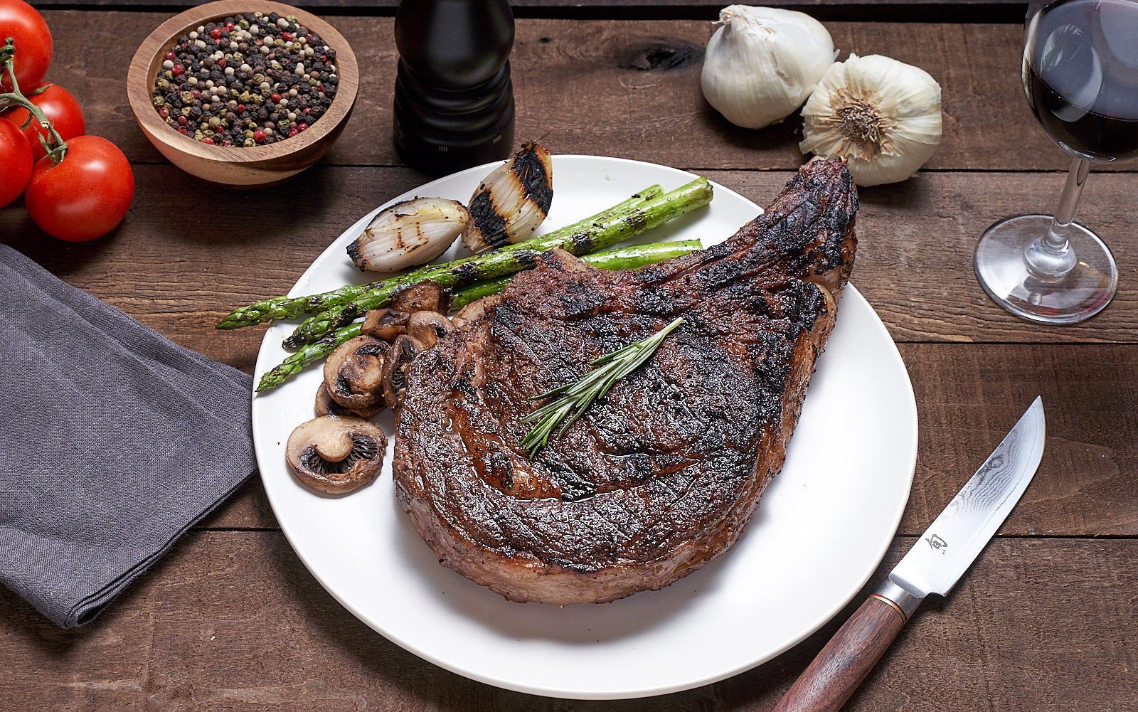 Bone in American Wagyu with side of asparagus and mushrooms