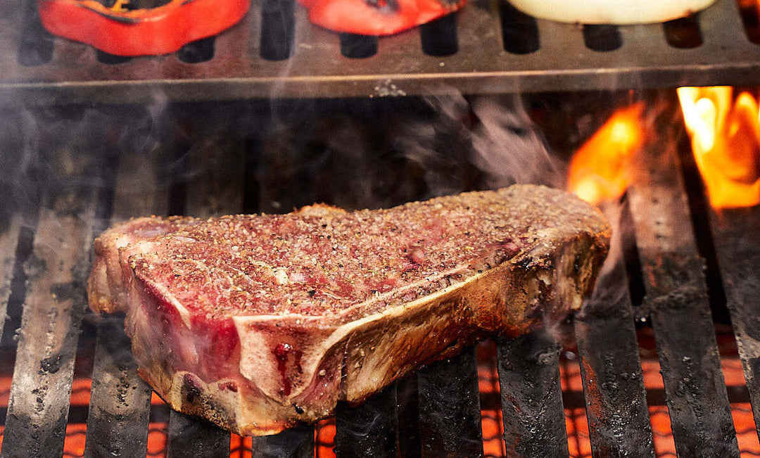 Juicy Kansas City Strip on a flaming grill