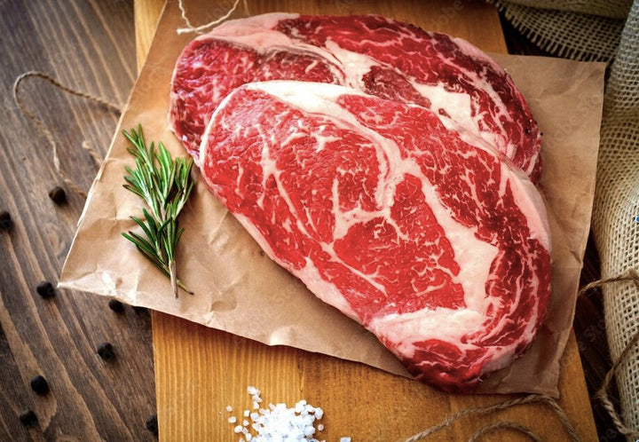 Raw boneless ribeye with expert marbling